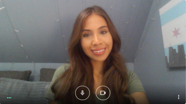 Woman with long hair smiling.